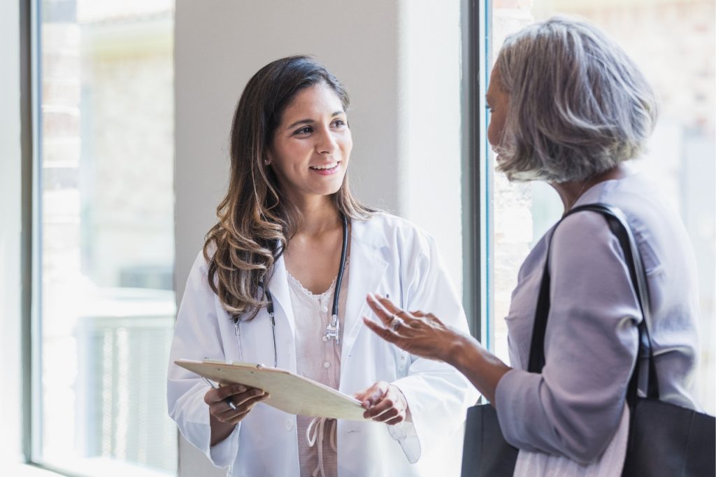 mexico gynecology center doctor with older patient